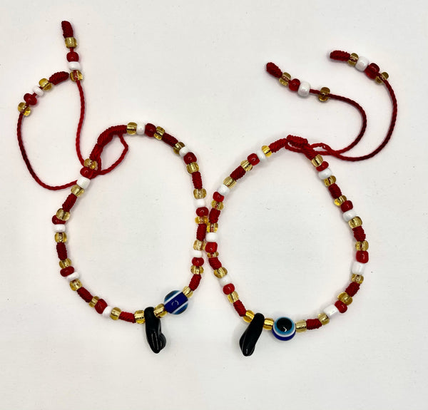 Braided Red, White, and Yellow Bracelet with Powerful Hand and Eye