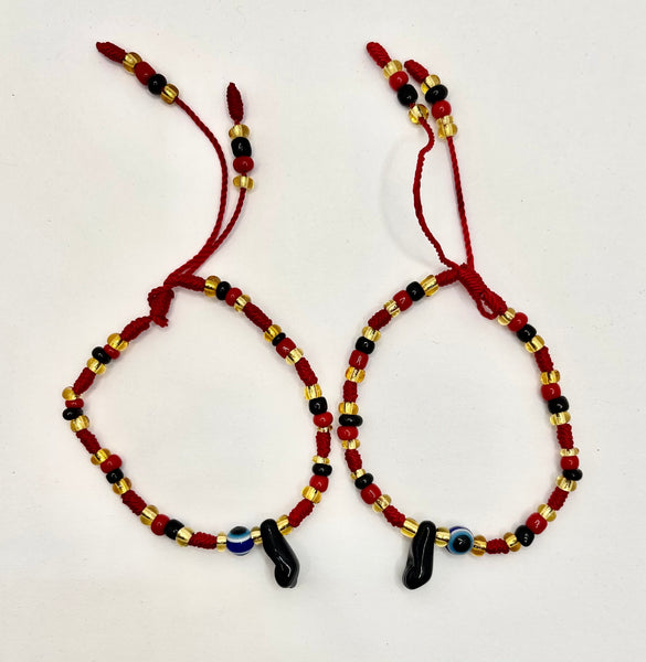 Braided Red, Black, and Yellow Bracelet with Powerful Hand and Eye